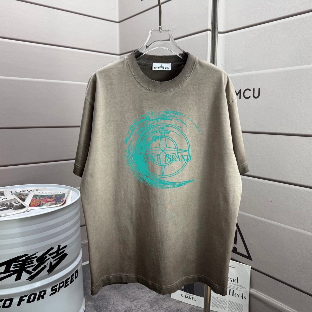 Stone Island Spring–Summer 2026 T-Shirt — 320gsm Washed Distressed Cotton, Teal Swirl Brushstroke Compass Rose Print