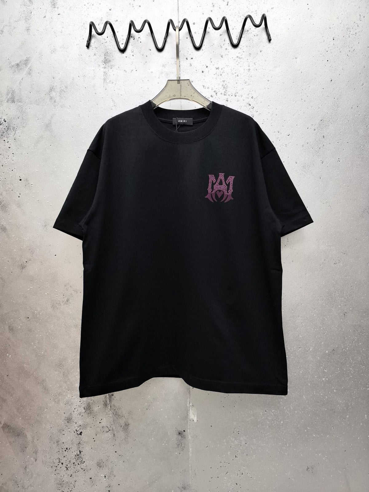 AMIRI Gothic Monogram Chest Graphic Crew Neck Short‑Sleeve T‑Shirt