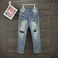 AMIRI Ripped Ribbed Patch Slim‑Fit Denim Jeans