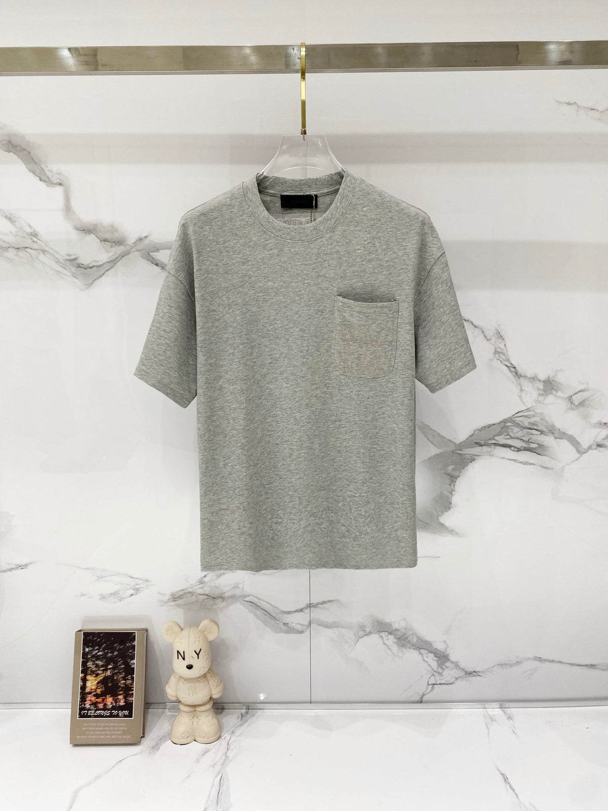 AMIRI Chest Pocket Subtle Embossed Graphic Crew Neck Short‑Sleeve T‑Shirt