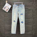 AMIRI Blue Ribbed Patch Diamond‑Rip Distressed Slim‑Fit Denim Jeans
