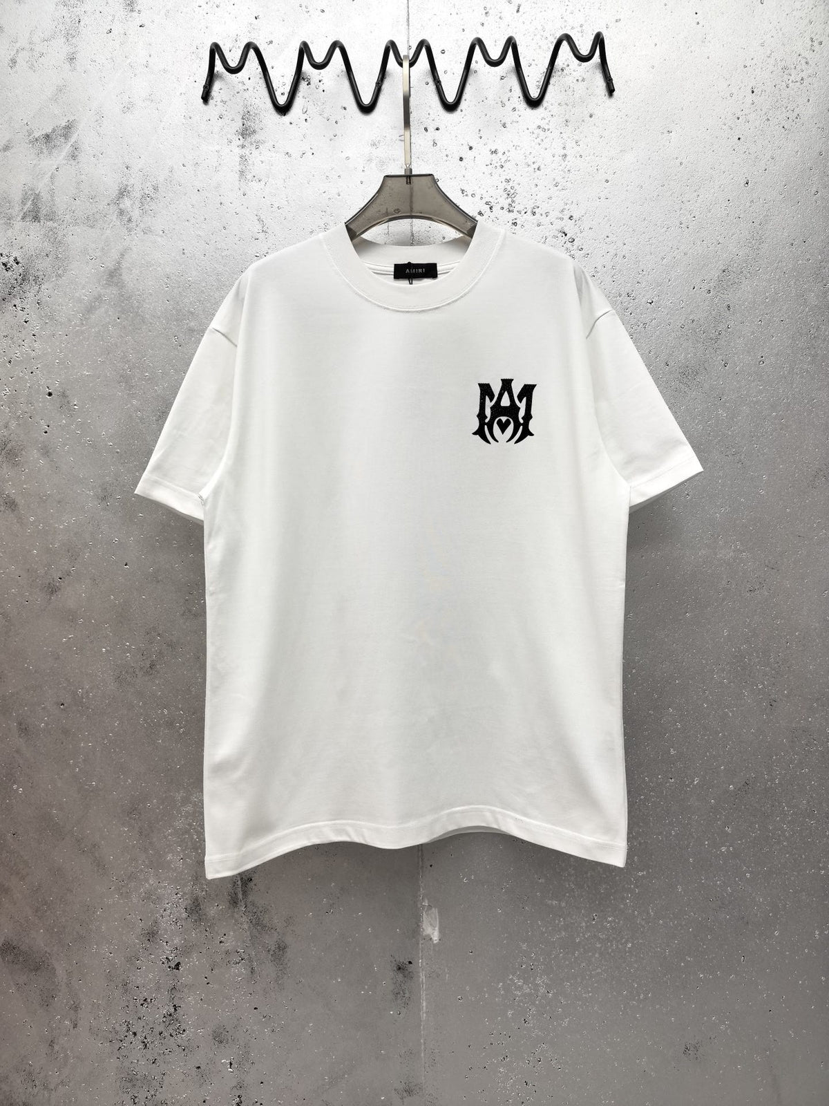 AMIRI Gothic Monogram Chest Graphic Crew Neck Short‑Sleeve T‑Shirt