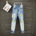 AMIRI Yellow Patch Distressed Printed Slim‑Fit Denim Jeans