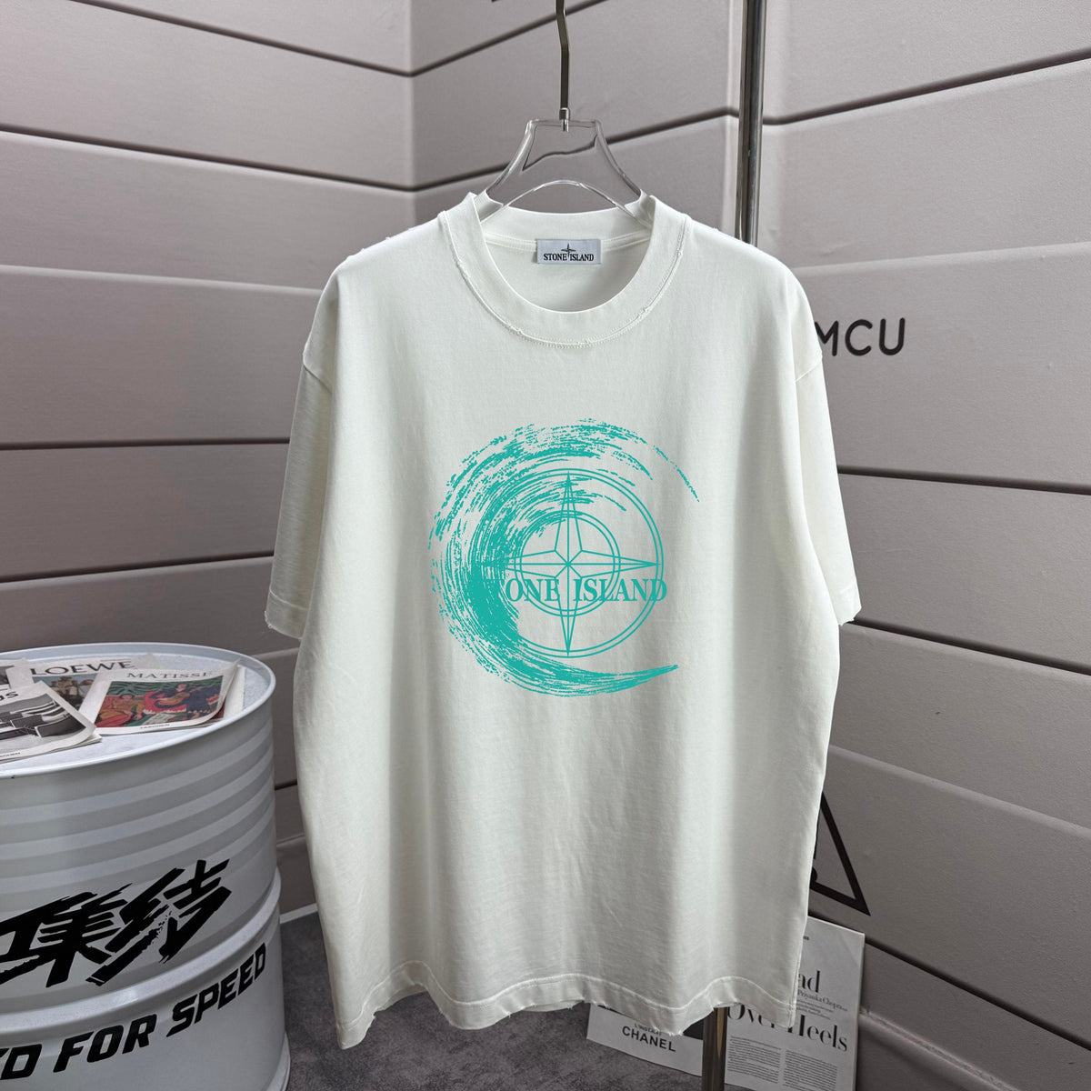 Stone Island Spring–Summer 2026 T-Shirt — 320gsm Washed Distressed Cotton, Teal Swirl Brushstroke Compass Rose Print