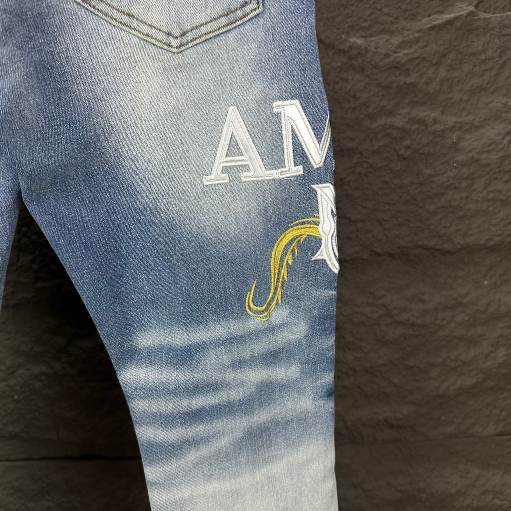 AMIRI Yellow Patch Distressed Printed Slim‑Fit Denim Jeans