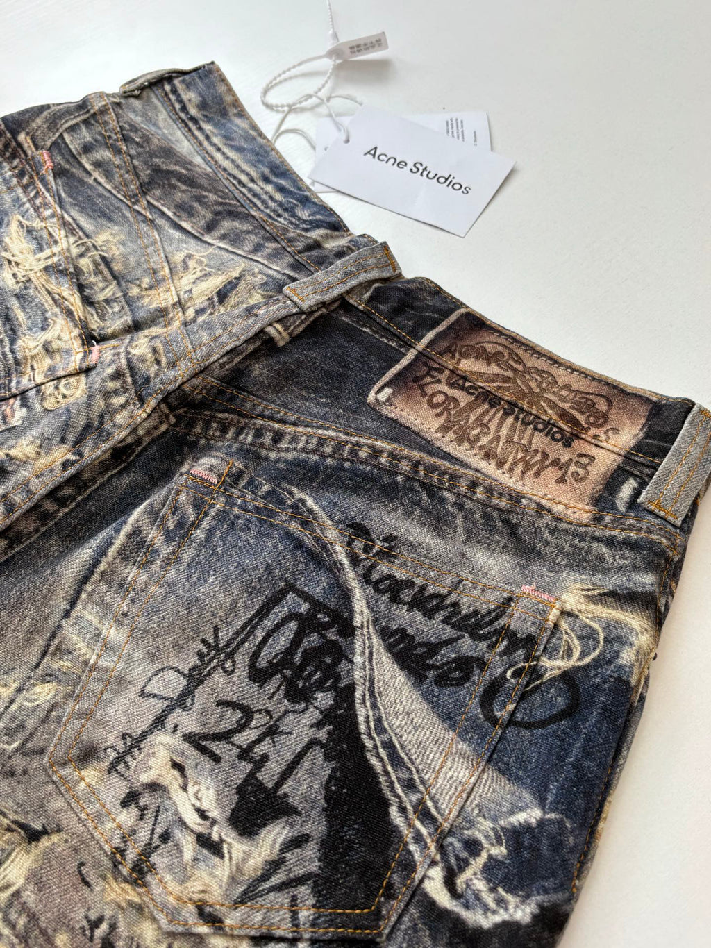 Acne Studios Graffiti‑Print Distressed Wide‑Leg Jeans