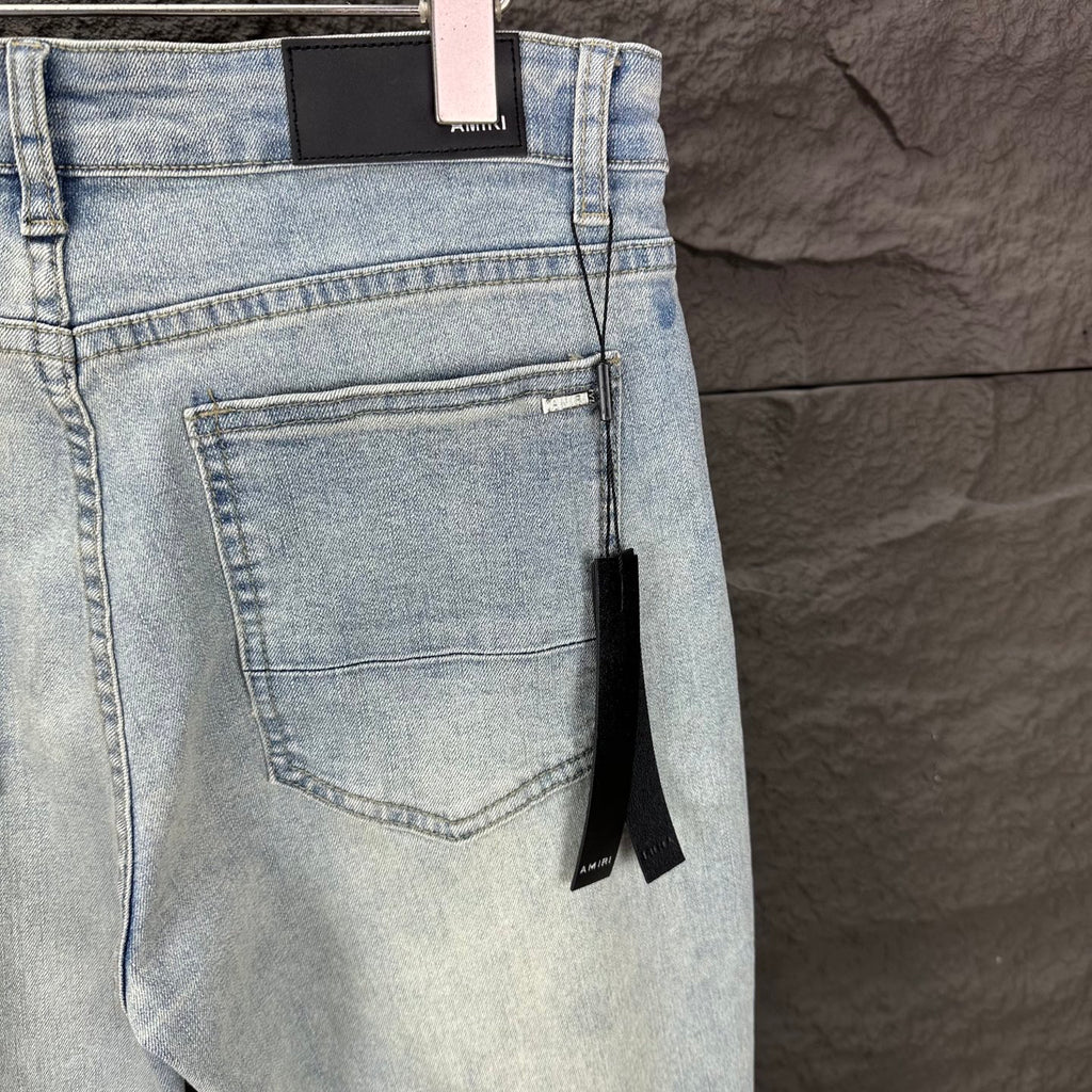 AMIRI Black Ribbed Patch Distressed Slim‑Fit Denim Jeans