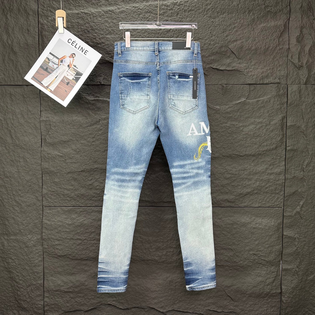AMIRI Yellow Patch Distressed Printed Slim‑Fit Denim Jeans