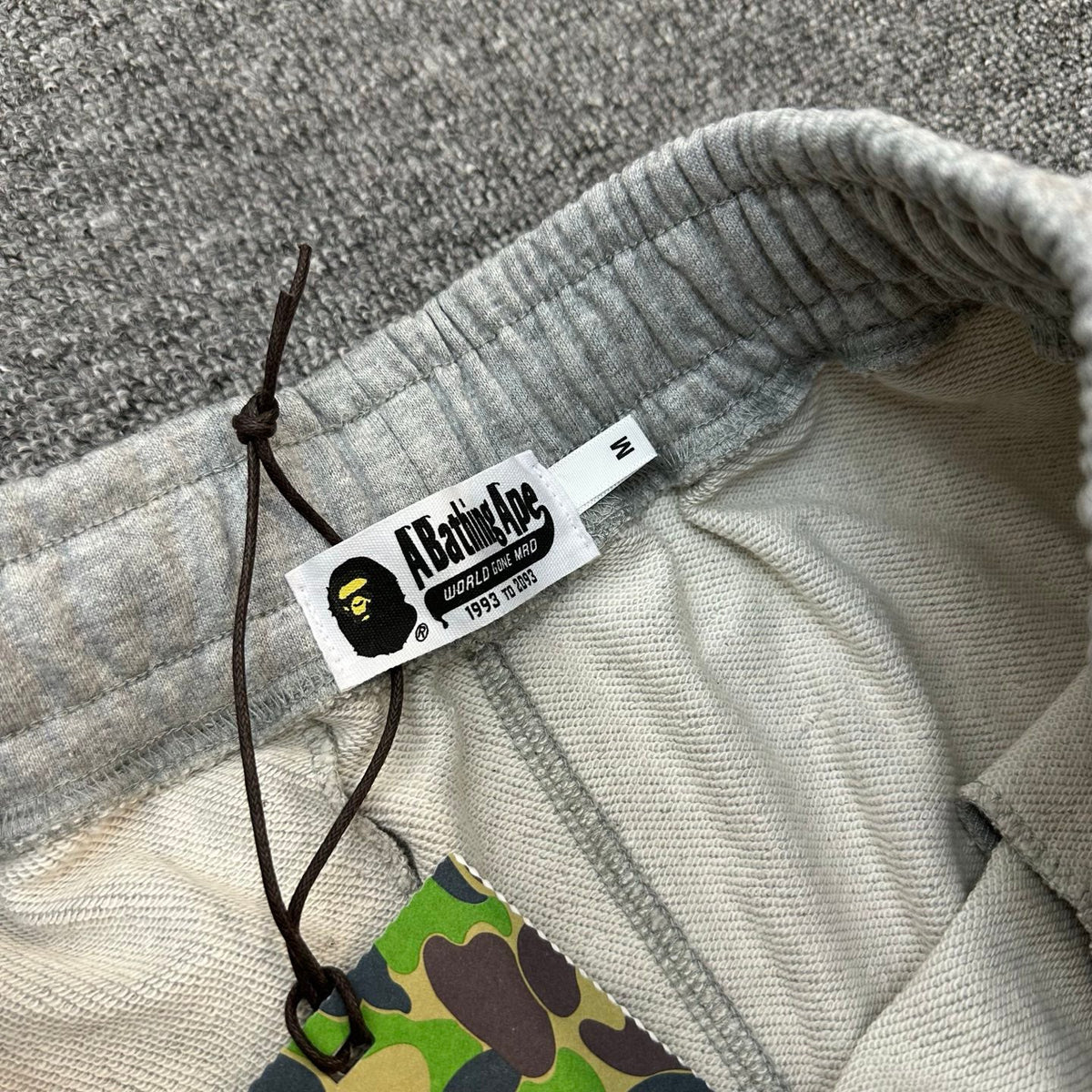 A Bathing Ape Wordmark Embroidered Raw Hem Shorts - Black / Gray