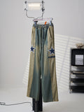 AMIRI Star‑Patch Paneled Drawstring Denim Pants