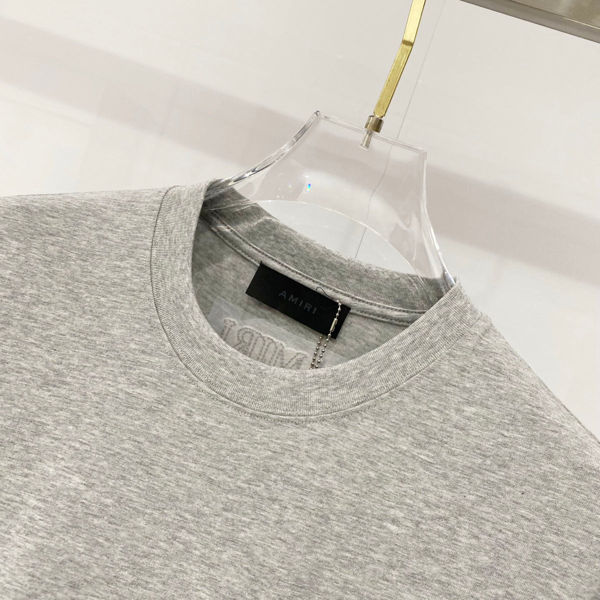 AMIRI Chest Pocket Subtle Embossed Graphic Crew Neck Short‑Sleeve T‑Shirt