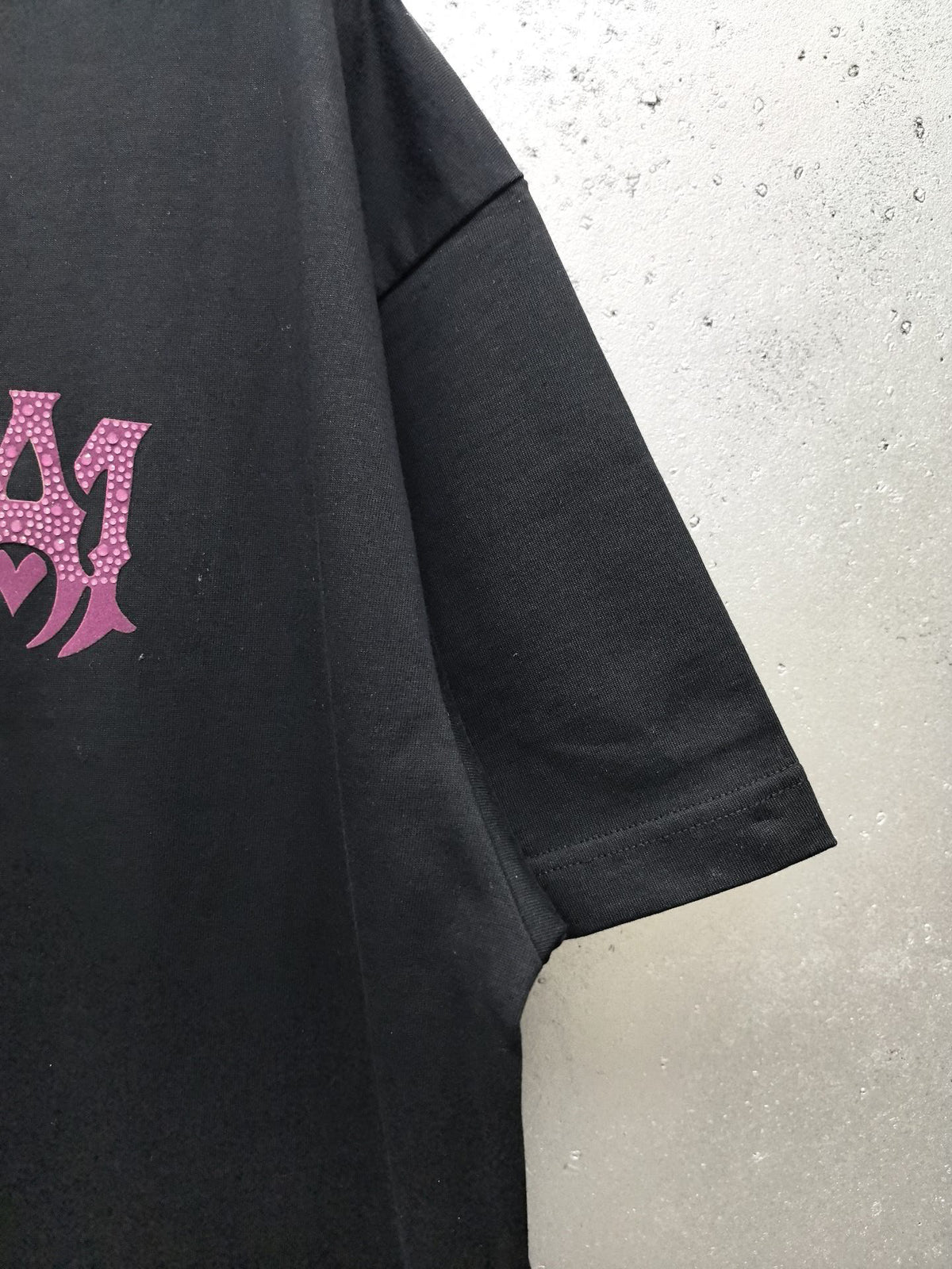 AMIRI Gothic Monogram Chest Graphic Crew Neck Short‑Sleeve T‑Shirt