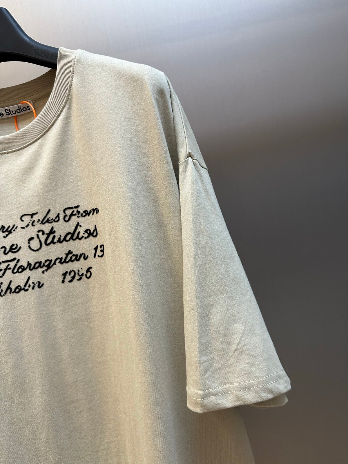 Acne Studios Vintage Cursive Text Print Oversized Short‑Sleeve T‑Shirt
