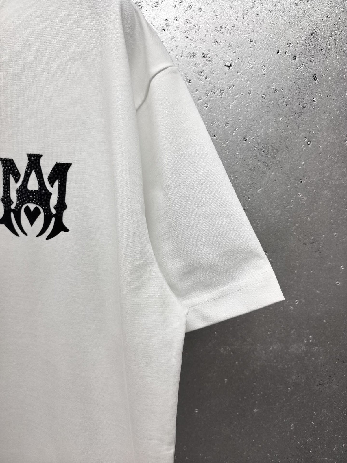 AMIRI Gothic Monogram Chest Graphic Crew Neck Short‑Sleeve T‑Shirt