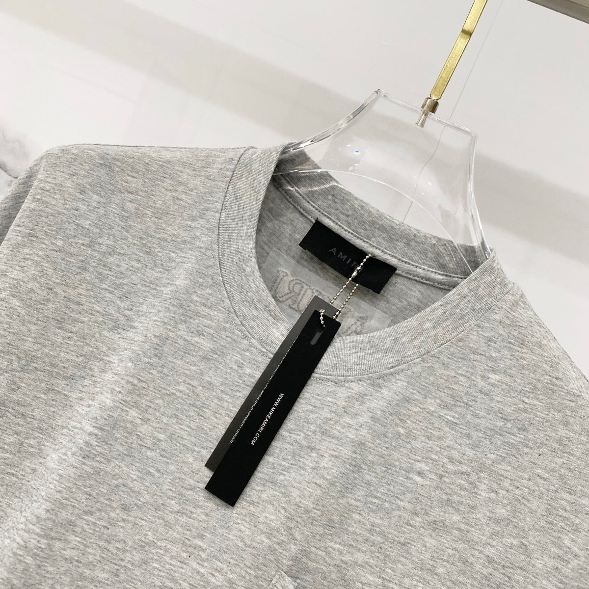 AMIRI Chest Pocket Subtle Embossed Graphic Crew Neck Short‑Sleeve T‑Shirt