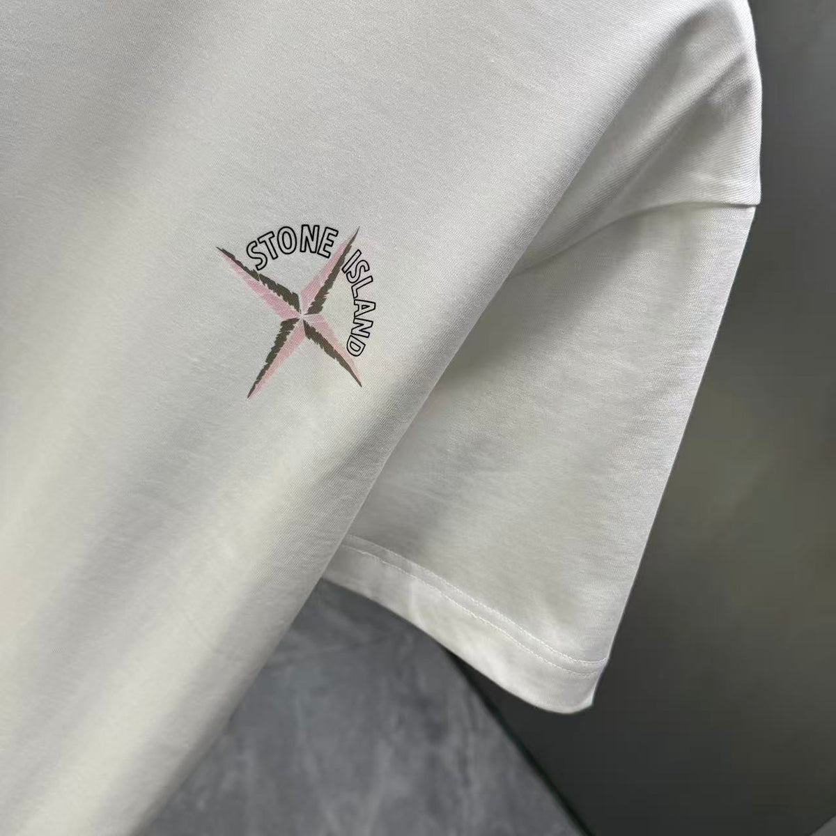 Stone Island Spring–Summer 2026 T-Shirt — Crystalline Prism-Effect Compass Star Print at Right Chest
