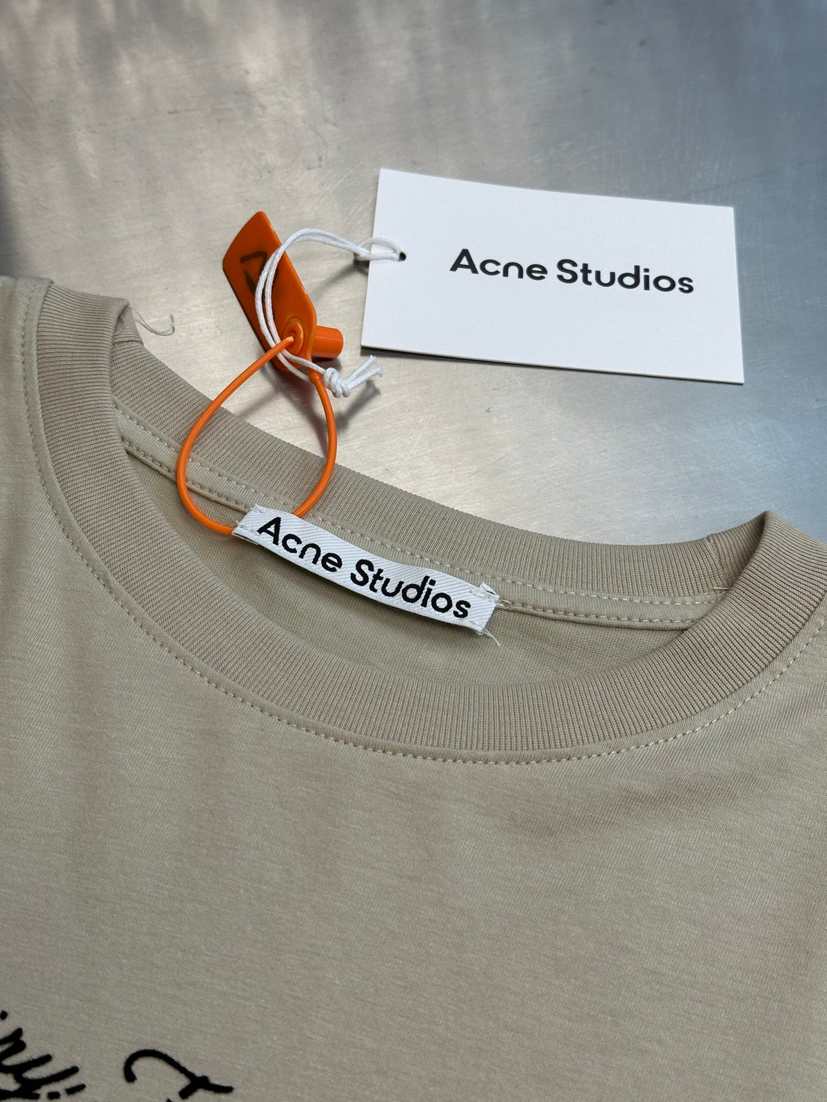 Acne Studios Vintage Cursive Text Print Oversized Short‑Sleeve T‑Shirt