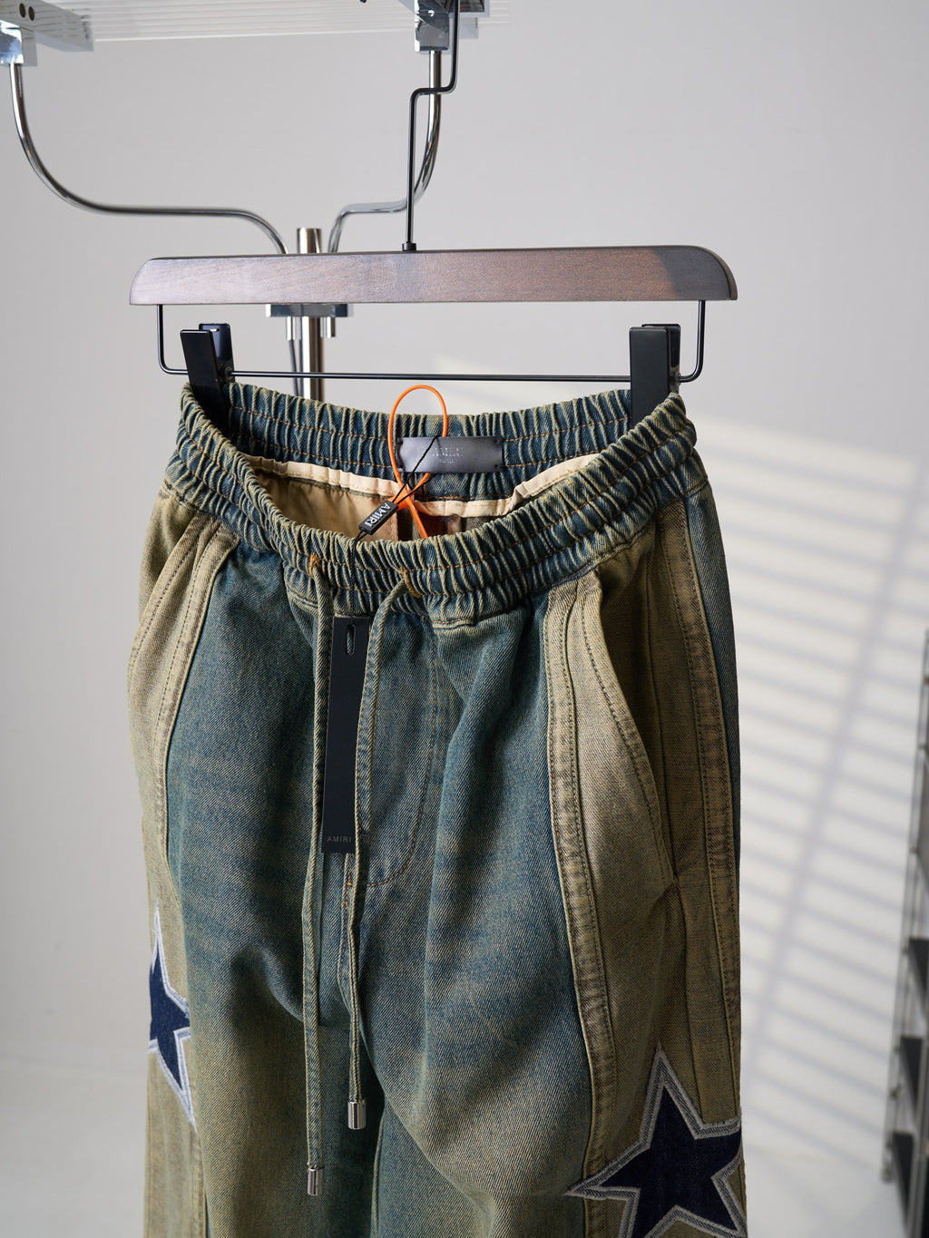 AMIRI Star‑Patch Paneled Drawstring Denim Pants