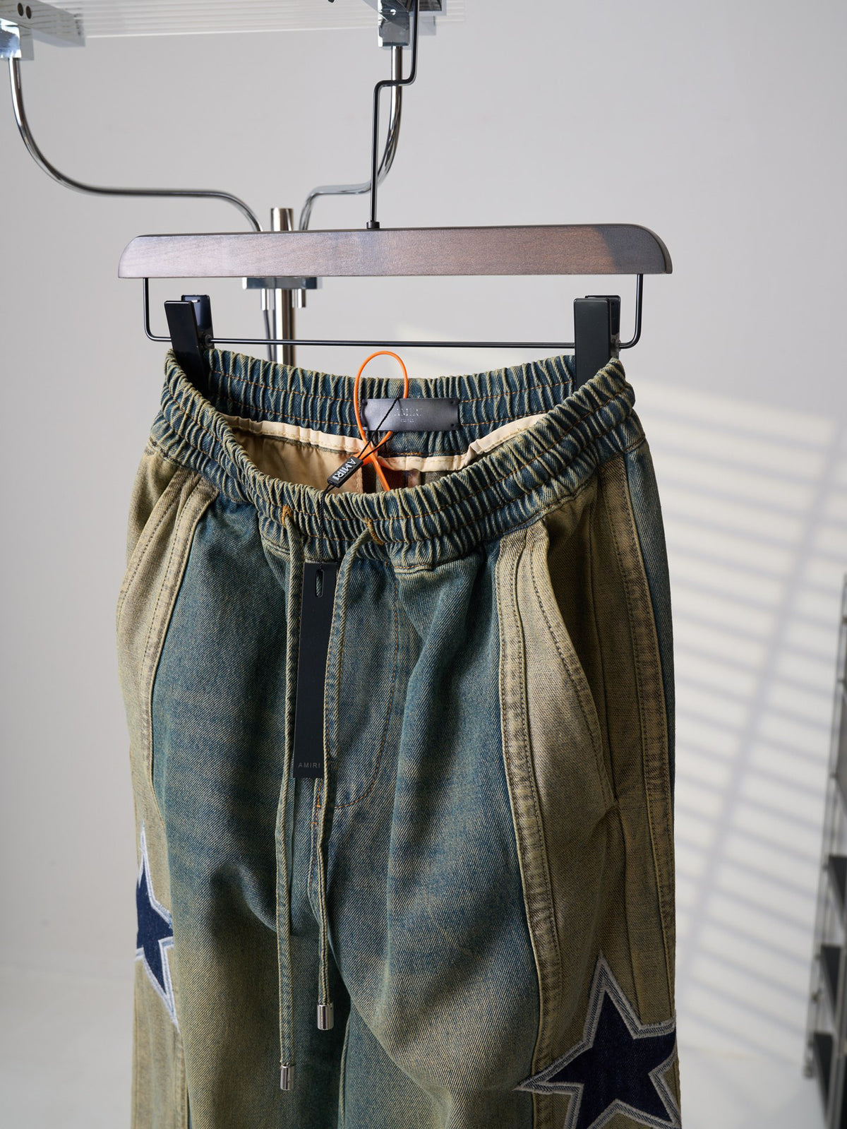 AMIRI Star‑Patch Paneled Drawstring Denim Pants