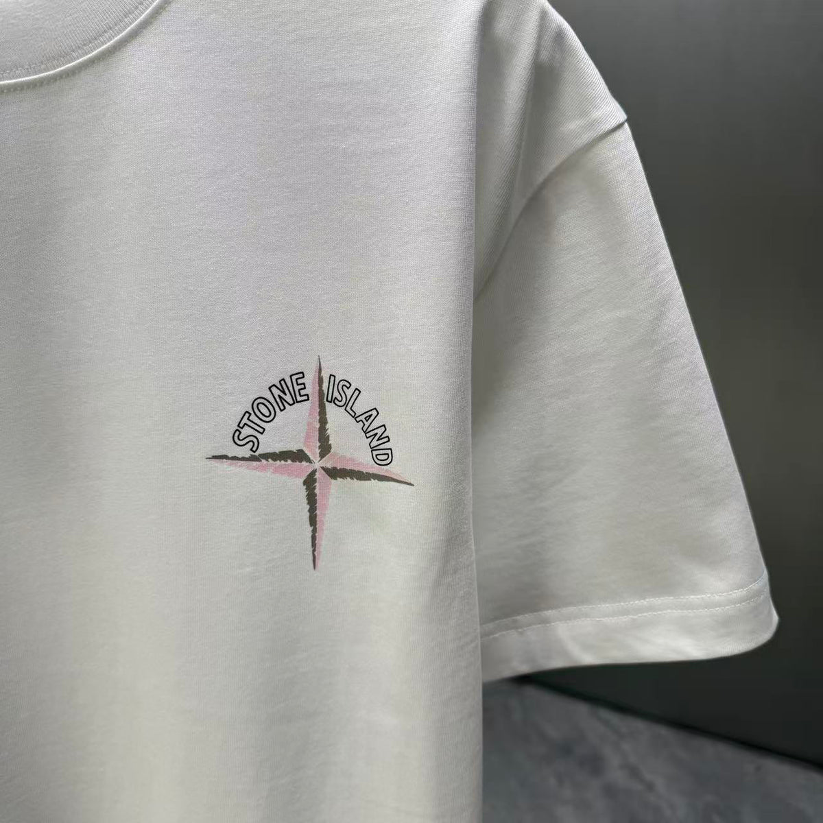 Stone Island Spring–Summer 2026 T-Shirt — Crystalline Prism-Effect Compass Star Print at Right Chest