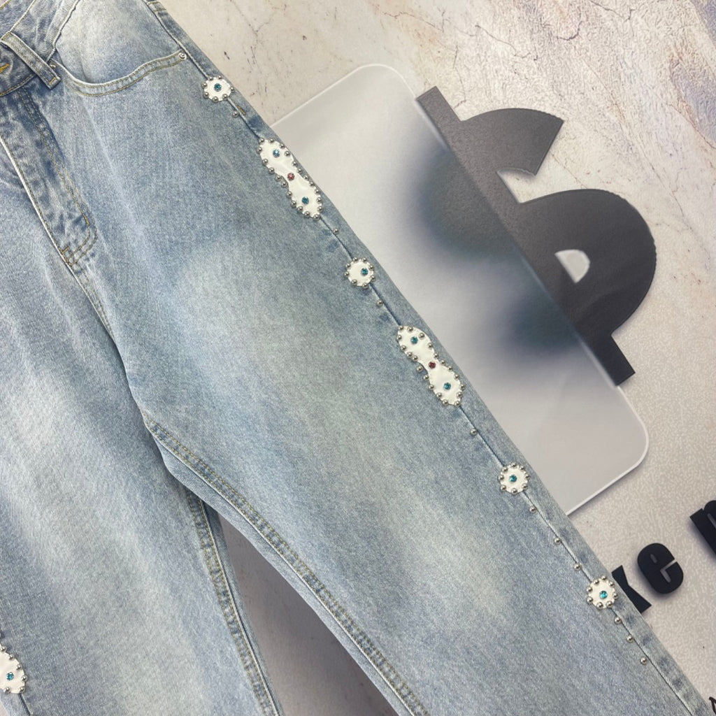 AMIRI Ornamental Stud Embellished Light‑Wash Flared Denim Jeans