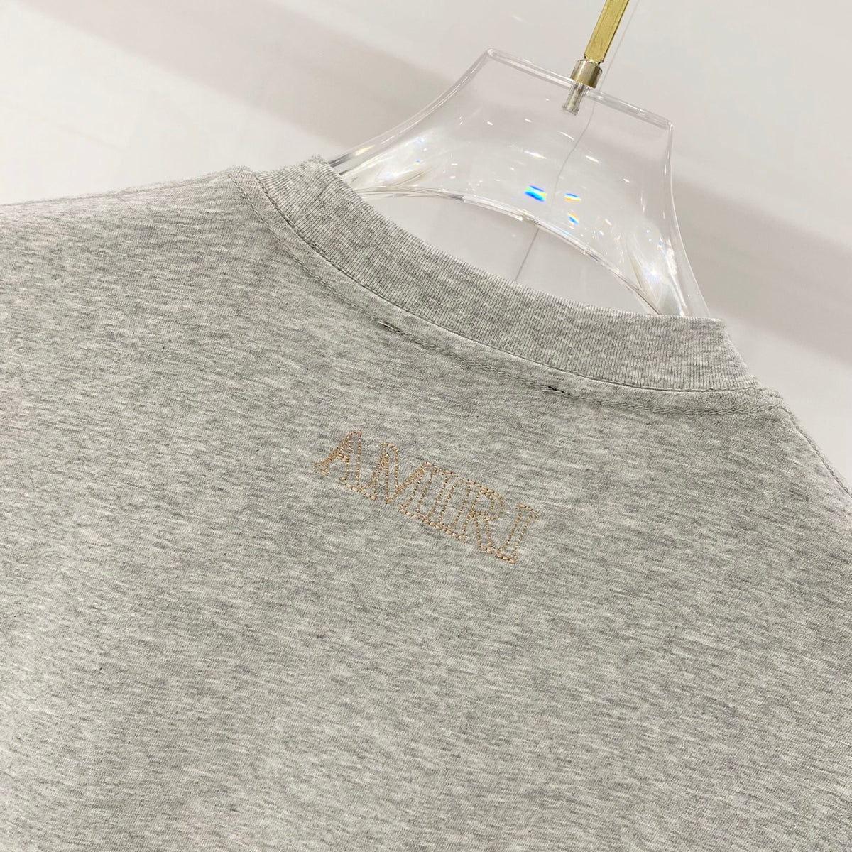 AMIRI Chest Pocket Subtle Embossed Graphic Crew Neck Short‑Sleeve T‑Shirt