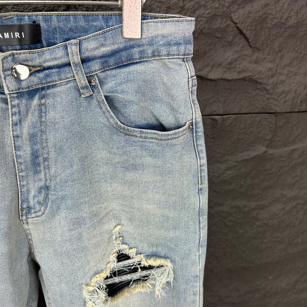 AMIRI Black Ribbed Patch Distressed Slim‑Fit Denim Jeans