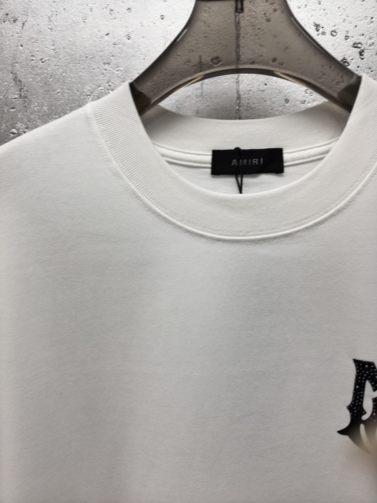 AMIRI Gothic Monogram Chest Graphic Crew Neck Short‑Sleeve T‑Shirt