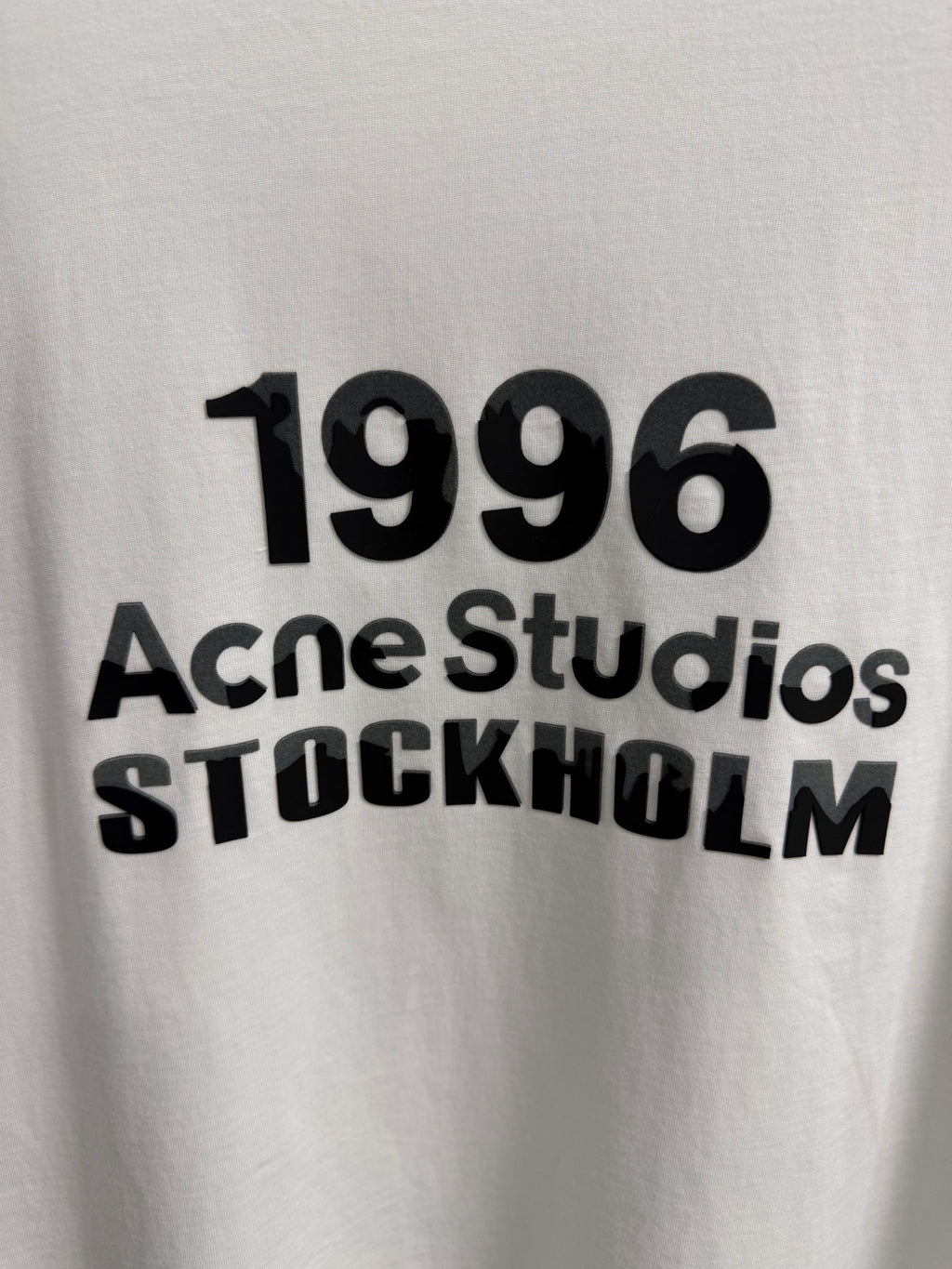 Acne Studios Stockholm 1996 Stacked‑Text Distressed‑Hem Oversized Crew‑Neck T‑Shirt