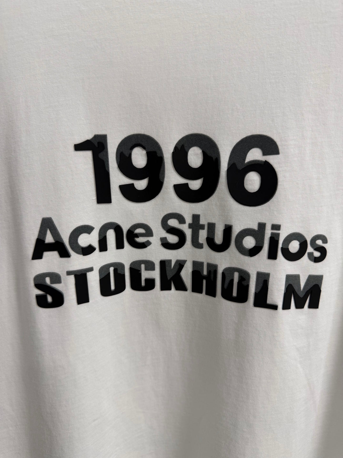 Acne Studios Stockholm 1996 Stacked‑Text Distressed‑Hem Oversized Crew‑Neck T‑Shirt