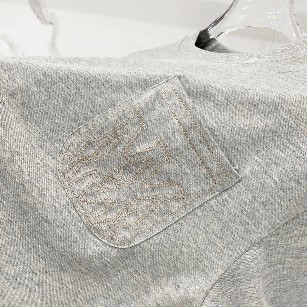 AMIRI Chest Pocket Subtle Embossed Graphic Crew Neck Short‑Sleeve T‑Shirt