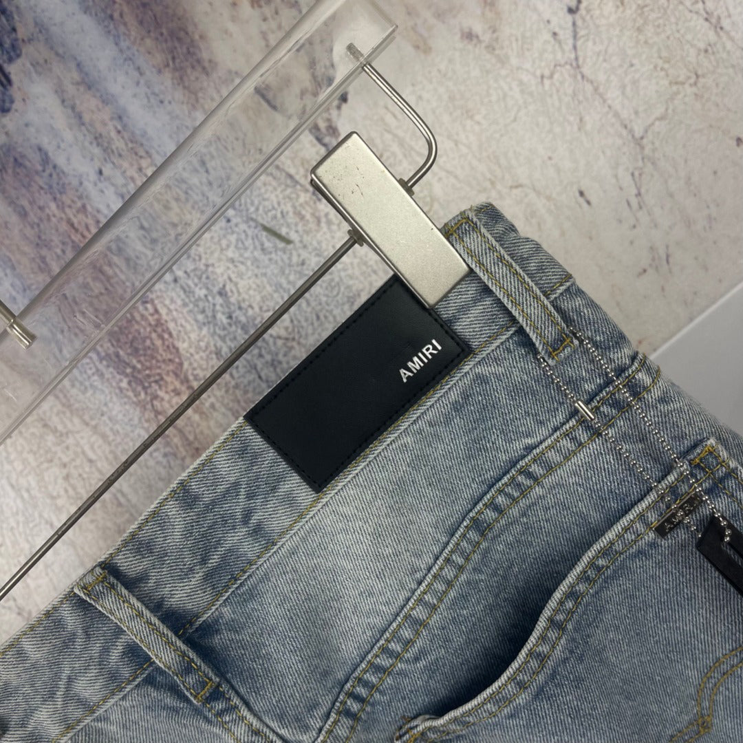 AMIRI Ornamental Stud Embellished Light‑Wash Flared Denim Jeans