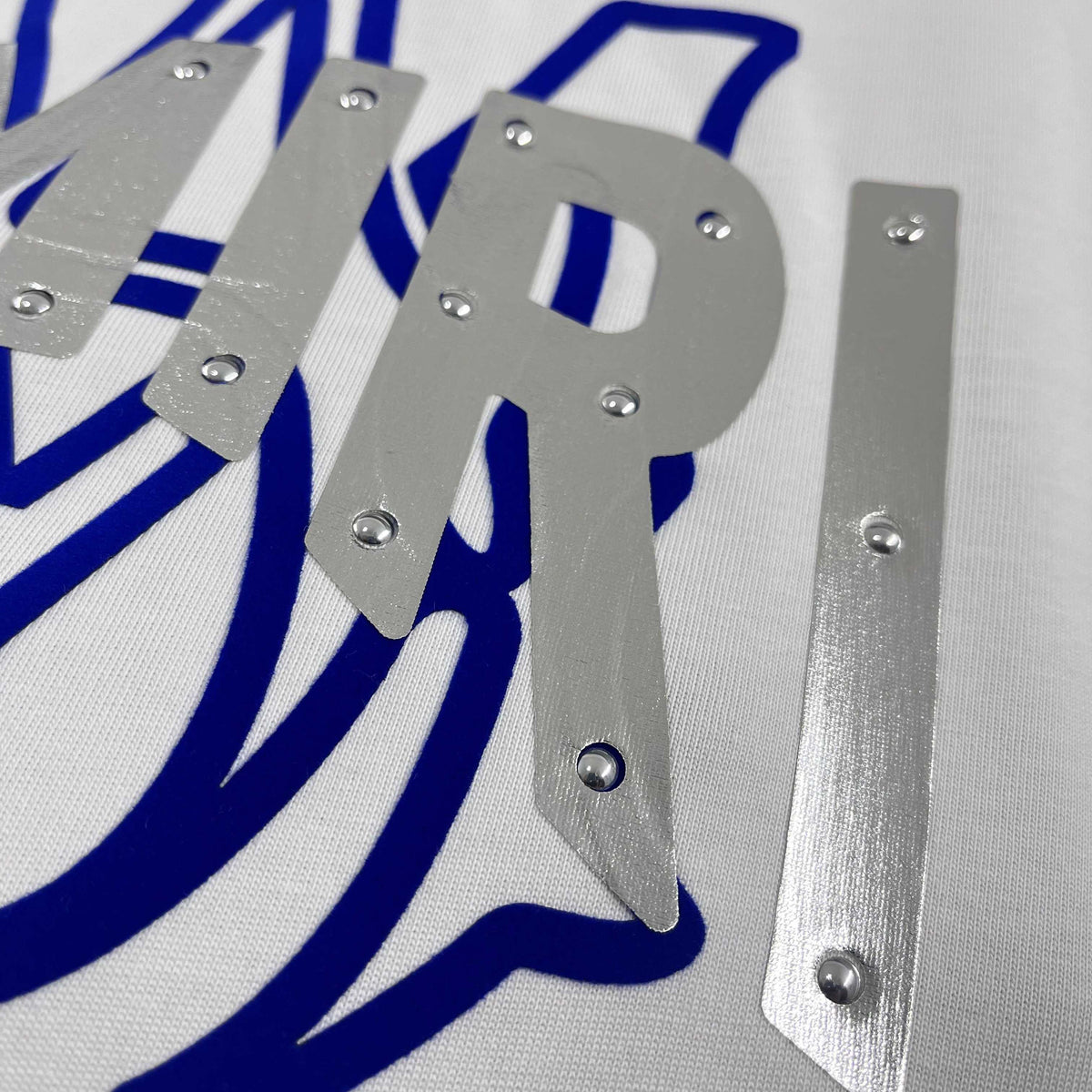 AMIRI MA Logo Riveted Letter Graphic Short‑Sleeve Tee