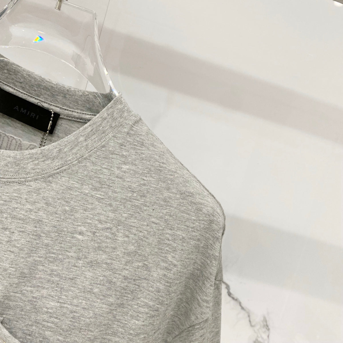 AMIRI Chest Pocket Subtle Embossed Graphic Crew Neck Short‑Sleeve T‑Shirt