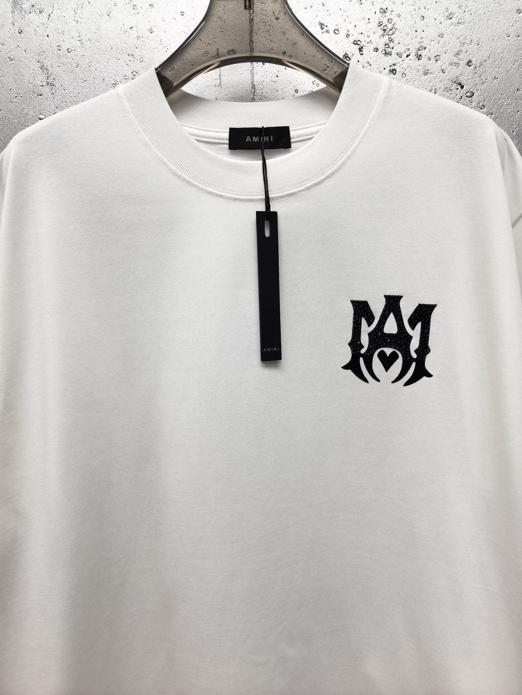 AMIRI Gothic Monogram Chest Graphic Crew Neck Short‑Sleeve T‑Shirt