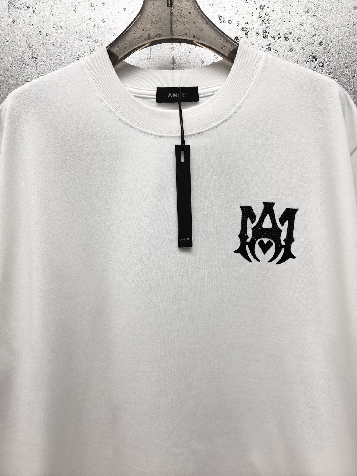 AMIRI Gothic Monogram Chest Graphic Crew Neck Short‑Sleeve T‑Shirt