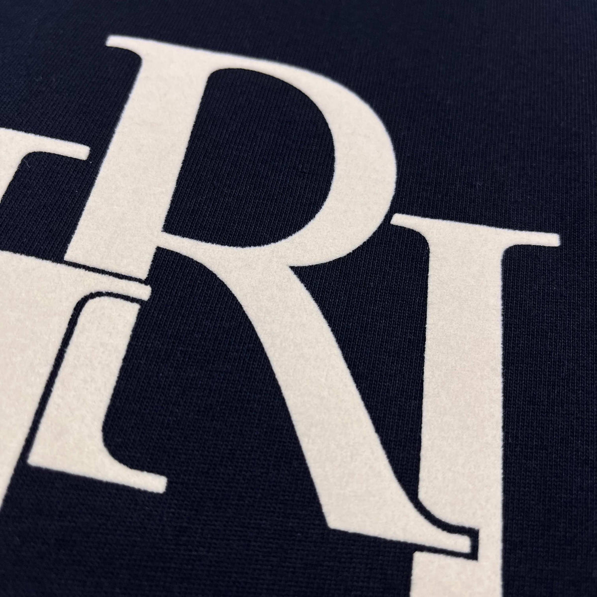 AMIRI Overlapping Stacked Letter Logo Crew Neck Short‑Sleeve T‑Shirt
