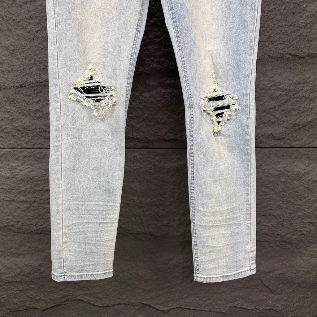 AMIRI Black Ribbed Patch Distressed Slim‑Fit Denim Jeans