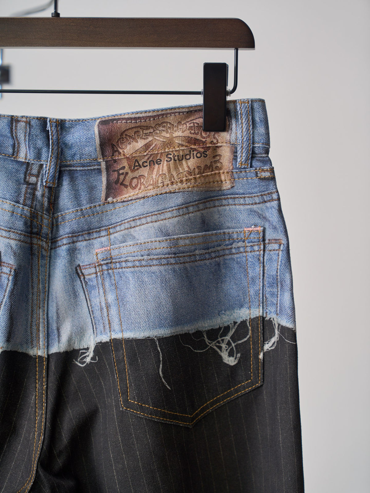 Acne Studios Spliced Deconstructed Wide‑Leg Denim Trousers