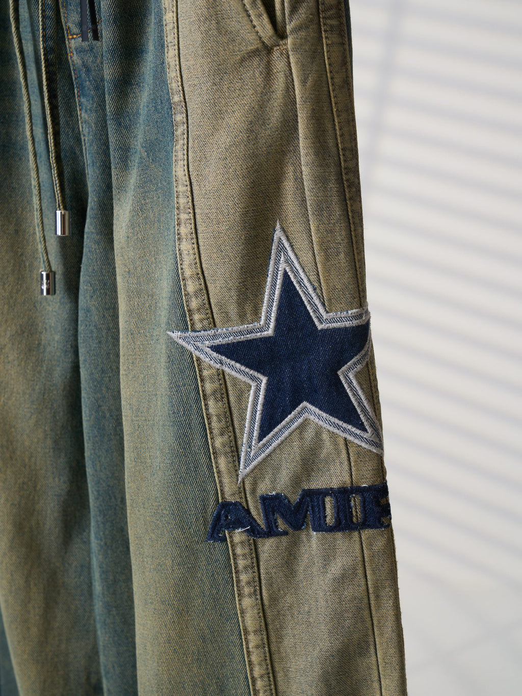 AMIRI Star‑Patch Paneled Drawstring Denim Pants