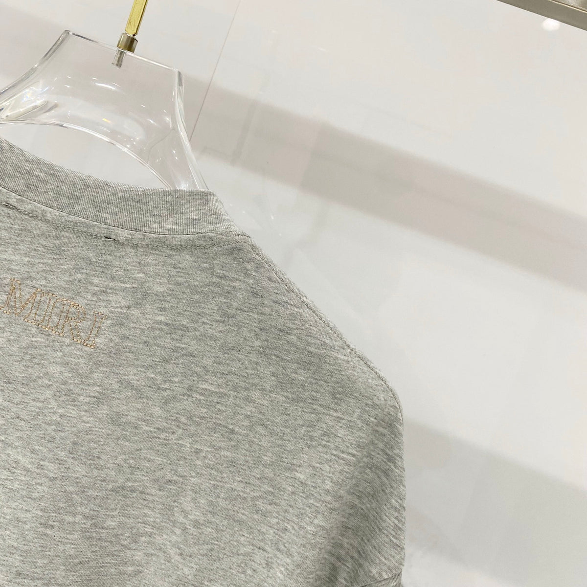 AMIRI Chest Pocket Subtle Embossed Graphic Crew Neck Short‑Sleeve T‑Shirt