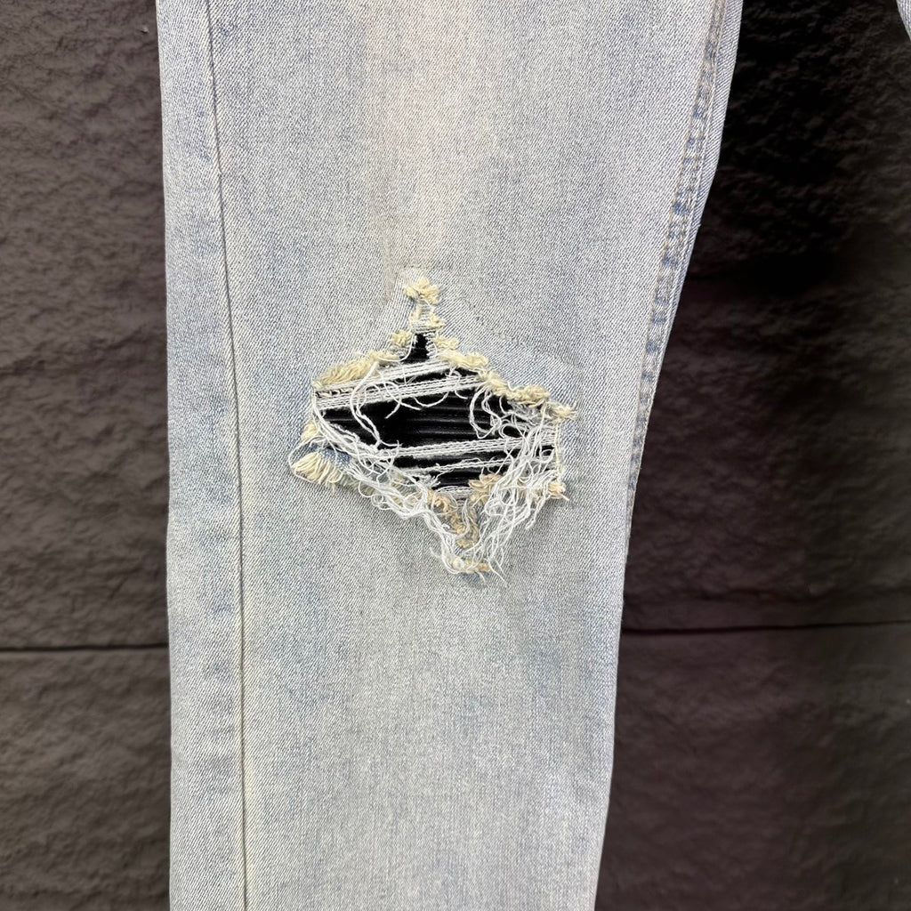 AMIRI Black Ribbed Patch Distressed Slim‑Fit Denim Jeans