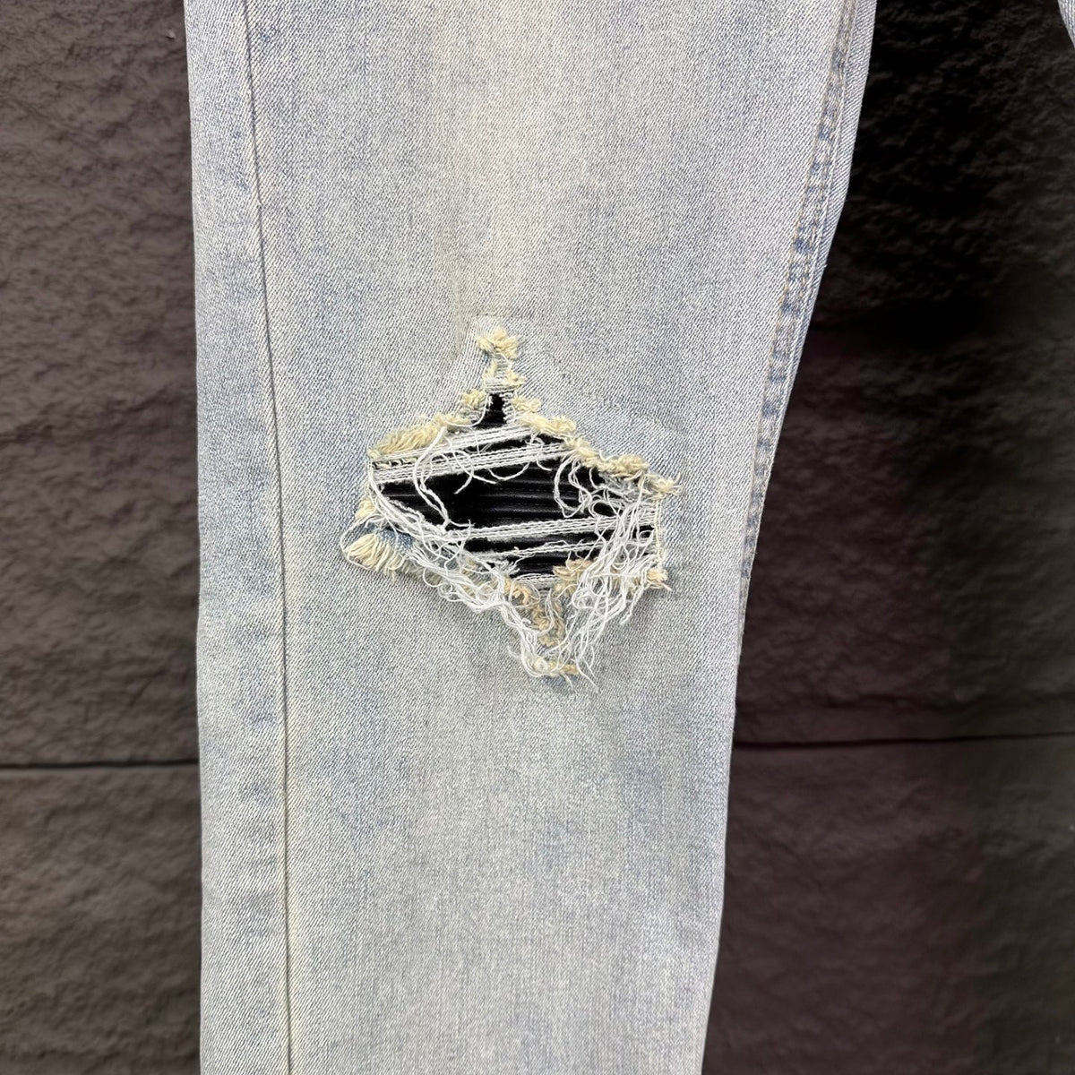 AMIRI Black Ribbed Patch Distressed Slim‑Fit Denim Jeans