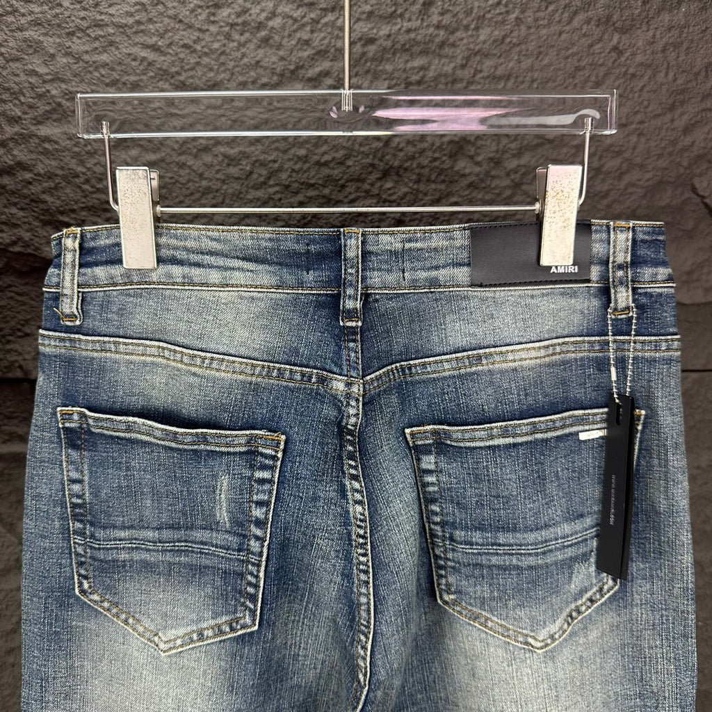AMIRI Ripped Ribbed Patch Slim‑Fit Denim Jeans