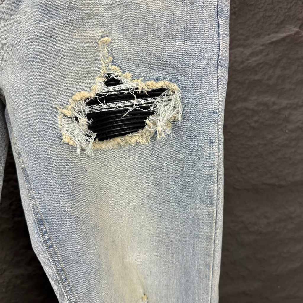 AMIRI Black Ribbed Patch Distressed Slim‑Fit Denim Jeans